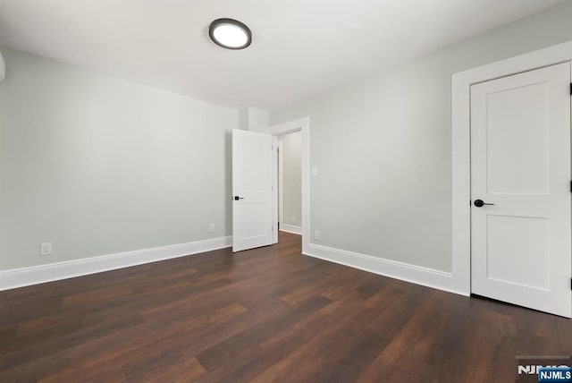 240 Berry St, Hackensack, NJ 07601 - spare room featuring dark wood-type flooring and baseboards