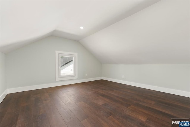 240 Berry St, Hackensack, NJ 07601 - bonus room with vaulted ceiling, dark wood finished floors, and baseboards
