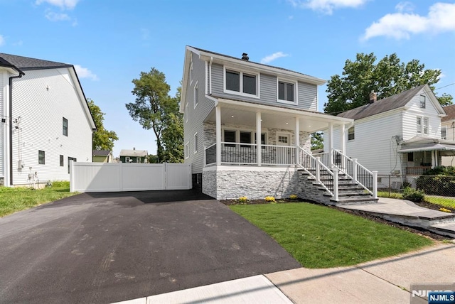 240 Berry St, Hackensack, NJ 07601 - american foursquare style home with covered porch, asphalt driveway, and stairs
