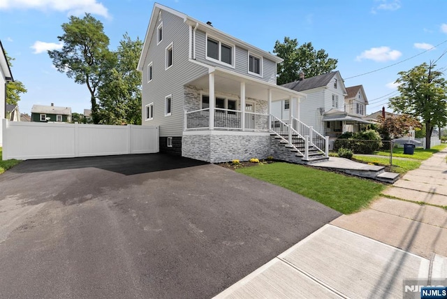 240 Berry St, Hackensack, NJ 07601 - view of front facade with a porch and stone siding