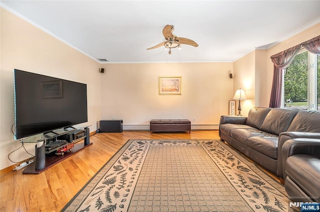 81 Columbus Ave, Totowa, NJ 07512 - living room with wood finished floors, a baseboard heating unit, ornamental molding, ceiling fan, and a baseboard radiator