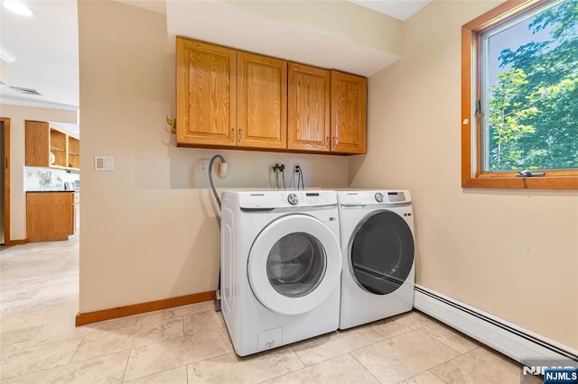81 Columbus Ave, Totowa, NJ 07512 - laundry area with baseboard heating, cabinet space, separate washer and dryer, baseboards, and light marble finish floors