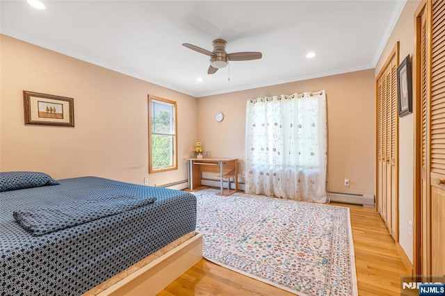 81 Columbus Ave, Totowa, NJ 07512 - bedroom with light wood finished floors, recessed lighting, crown molding, a baseboard radiator, and a ceiling fan