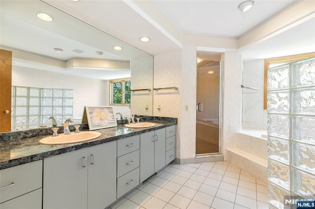 81 Columbus Ave, Totowa, NJ 07512 - bathroom with double vanity, a bath, a shower stall, tile patterned floors, and recessed lighting