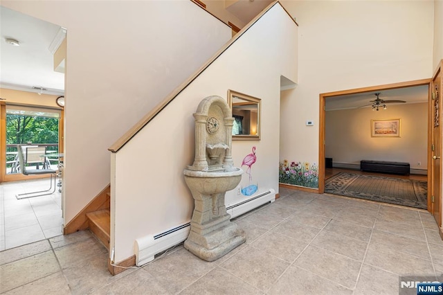 81 Columbus Ave, Totowa, NJ 07512 - stairs with a baseboard heating unit, baseboards, a ceiling fan, and tile patterned floors