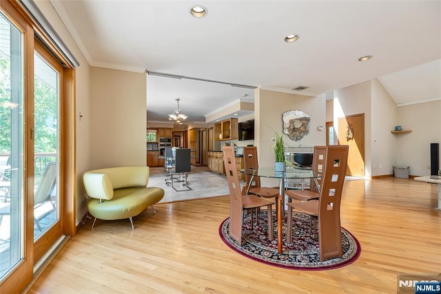 81 Columbus Ave, Totowa, NJ 07512 - dining space with crown molding, light wood finished floors, a chandelier, recessed lighting, and baseboards