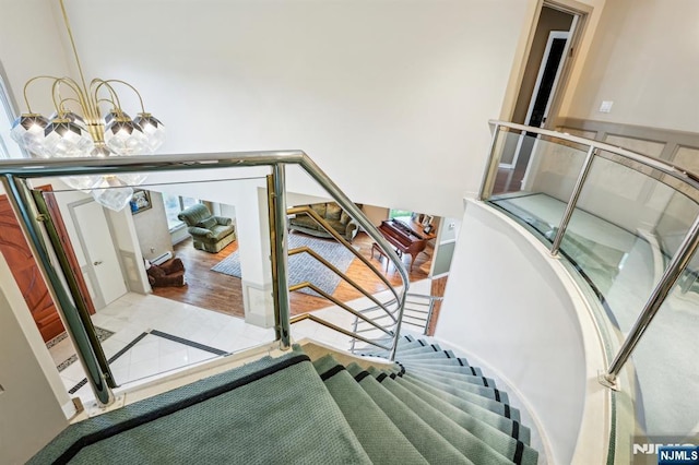 31 Bourbon St, Wayne, NJ 07470 - stairway featuring a chandelier