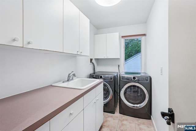 31 Bourbon St, Wayne, NJ 07470 - laundry room featuring cabinet space, separate washer and dryer, and light tile patterned floors
