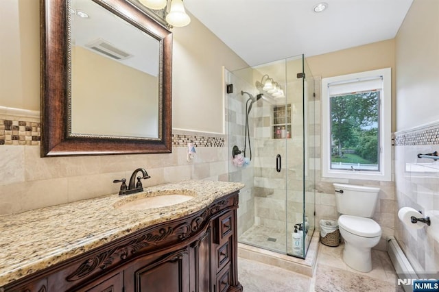 31 Bourbon St, Wayne, NJ 07470 - full bath with tile walls, vanity, toilet, a stall shower, and baseboard heating