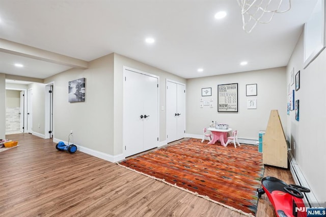 31 Bourbon St, Wayne, NJ 07470 - recreation room with wood finished floors, recessed lighting, and baseboards