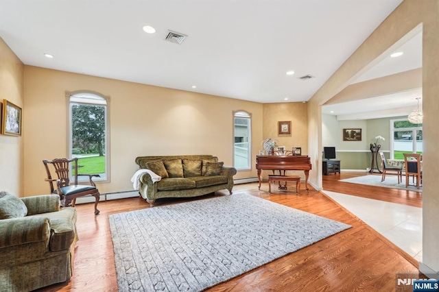 31 Bourbon St, Wayne, NJ 07470 - living room with baseboard heating, light wood-style floors, and recessed lighting