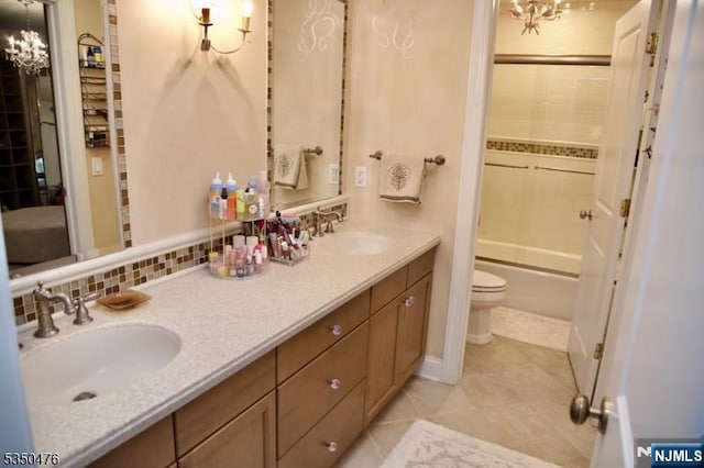 5 Young Ct, East Hanover Twp, NJ 07936 - full bath featuring toilet, double vanity, a chandelier, and tile patterned flooring