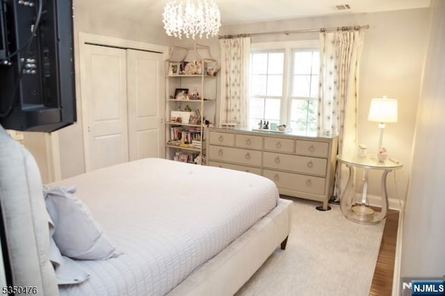 5 Young Ct, East Hanover Twp, NJ 07936 - bedroom with a closet, a chandelier, and baseboards