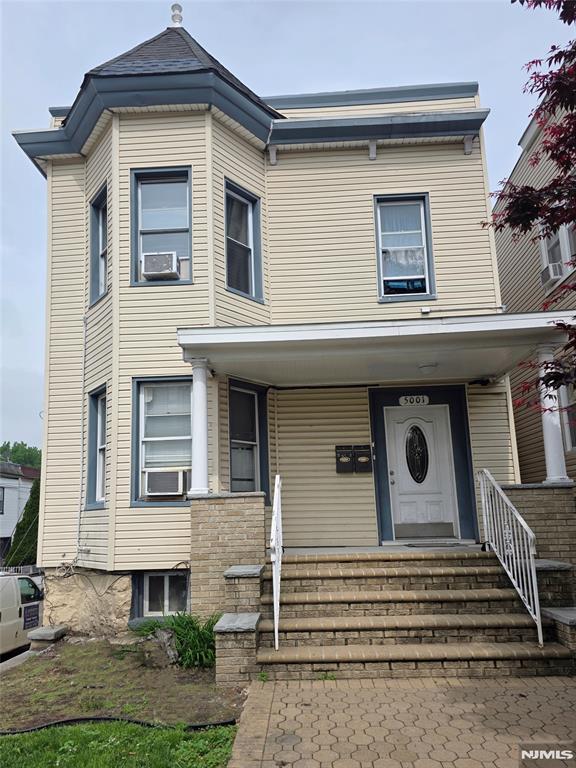 5001 Kennedy Blvd, North Bergen, NJ 07047 - view of front of home featuring a porch and cooling unit