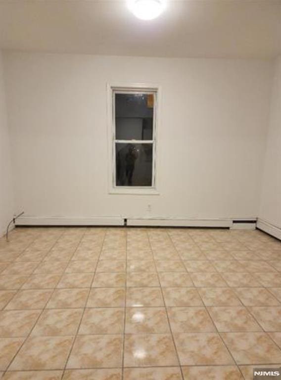 5001 Kennedy Blvd, North Bergen, NJ 07047 - empty room with light tile patterned floors