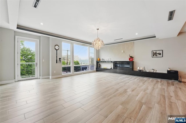 26 Hudson Ter, Edgewater, NJ 07020 - unfurnished living room featuring a chandelier, light wood-style floors, baseboards, and recessed lighting