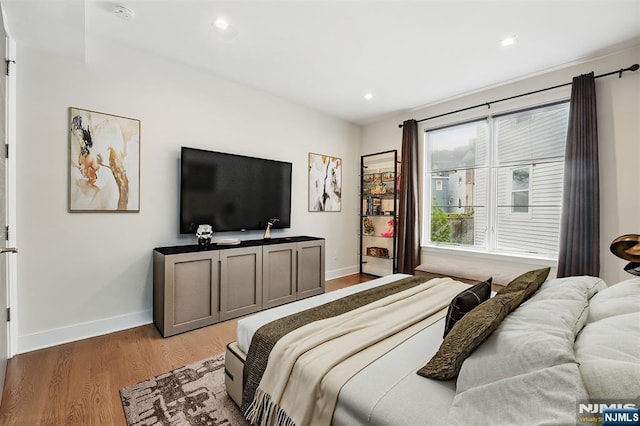 26 Hudson Ter, Edgewater, NJ 07020 - bedroom with light wood finished floors, baseboards, and recessed lighting