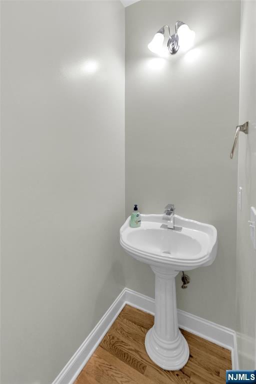 27 Tecumseh Trl, Oakland, NJ 07436 - bathroom featuring wood finished floors and baseboards