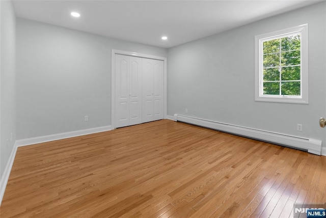 27 Tecumseh Trl, Oakland, NJ 07436 - unfurnished bedroom with baseboard heating, light wood finished floors, baseboards, and recessed lighting