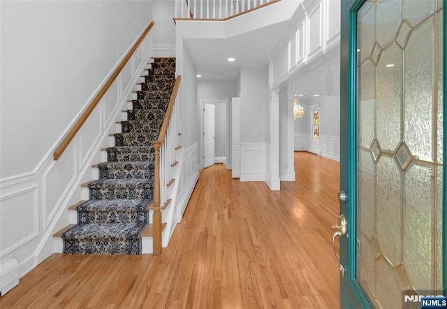 27 Tecumseh Trl, Oakland, NJ 07436 - entrance foyer featuring a decorative wall, light wood finished floors, stairs, a wainscoted wall, and recessed lighting