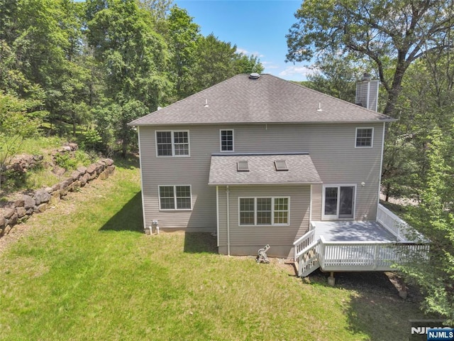 27 Tecumseh Trl, Oakland, NJ 07436 - back of house featuring a chimney, a wooden deck, a lawn, and a shingled roof