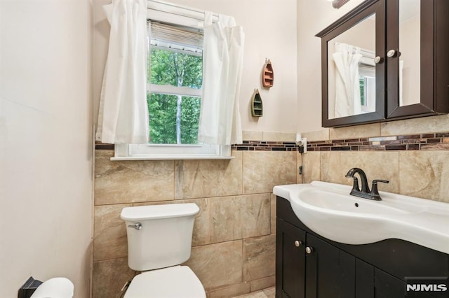 104 Leland Trl, Hopatcong, NJ 07843 - half bathroom featuring toilet, tile walls, and vanity