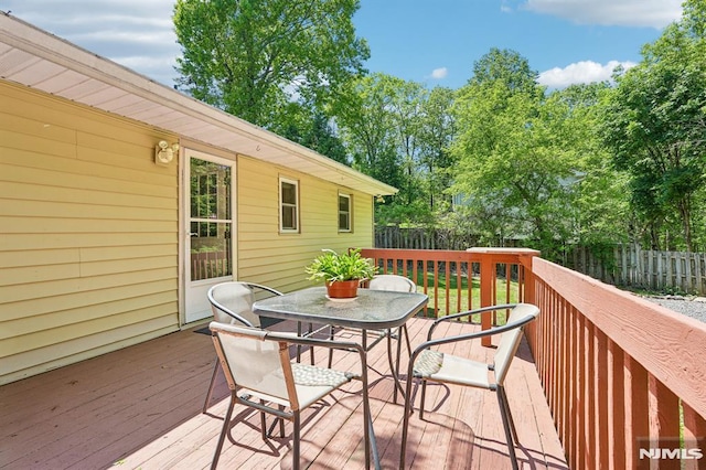 104 Leland Trl, Hopatcong, NJ 07843 - wooden deck featuring outdoor dining space and a fenced backyard