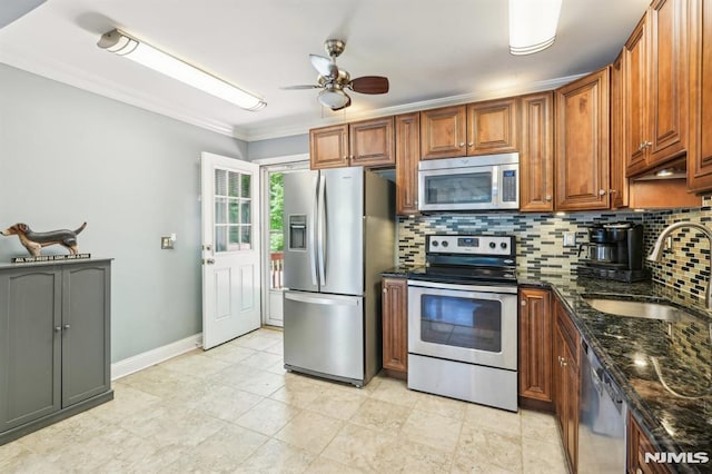 104 Leland Trl, Hopatcong, NJ 07843 - kitchen featuring stainless steel appliances, a sink, backsplash, a ceiling fan, and baseboards