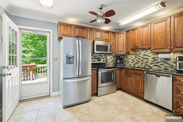 104 Leland Trl, Hopatcong, NJ 07843 - kitchen featuring appliances with stainless steel finishes, a sink, a ceiling fan, decorative backsplash, and ornamental molding
