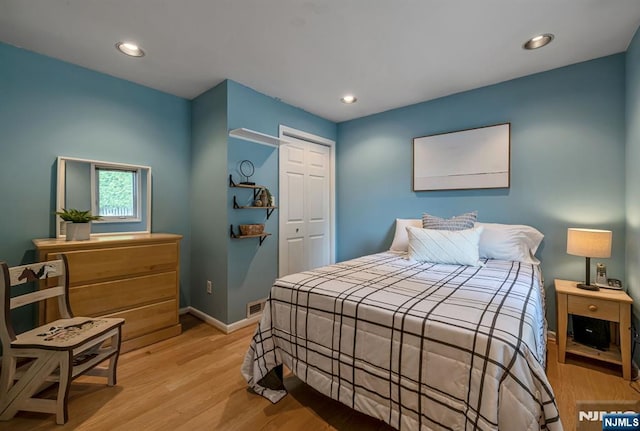 247 Wayne Ave, River Edge, NJ 07661 - bedroom featuring light wood-style floors, a closet, baseboards, and recessed lighting