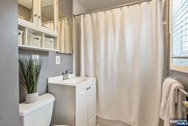 247 Wayne Ave, River Edge, NJ 07661 - full bathroom featuring toilet, vanity, and a shower with shower curtain
