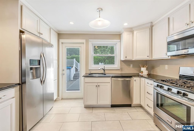 247 Wayne Ave, River Edge, NJ 07661 - kitchen featuring stainless steel appliances, dark countertops, a sink, recessed lighting, and crown molding