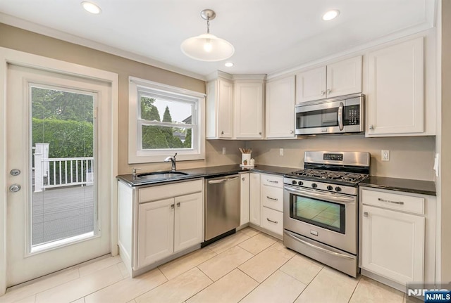 247 Wayne Ave, River Edge, NJ 07661 - kitchen with stainless steel appliances, a sink, dark countertops, decorative light fixtures, and recessed lighting