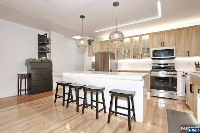 427 Stockton Pl Unit 2, Englewood, NJ 07631 - kitchen with stainless steel appliances, decorative backsplash, and light countertops