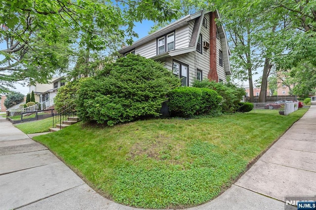 21 Spruce Ave, Ridgefield Park, NJ 07660 - view of home's exterior with a yard