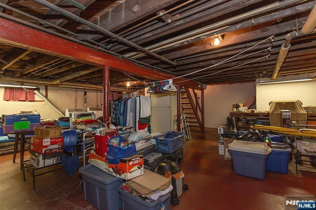 21 Spruce Ave, Ridgefield Park, NJ 07660 - below grade area with washing machine and clothes dryer, freestanding refrigerator, and stairway