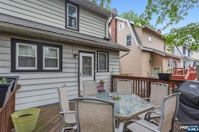 21 Spruce Ave, Ridgefield Park, NJ 07660 - wooden deck with outdoor dining area and grilling area