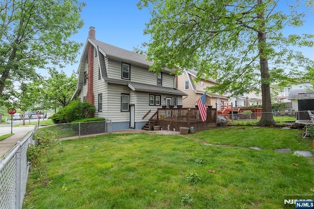 21 Spruce Ave, Ridgefield Park, NJ 07660 - rear view of property with a deck, a fenced backyard, a chimney, and a shingled roof