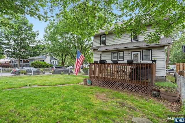 21 Spruce Ave, Ridgefield Park, NJ 07660 - rear view of house with a deck, a fenced backyard, and roof with shingles