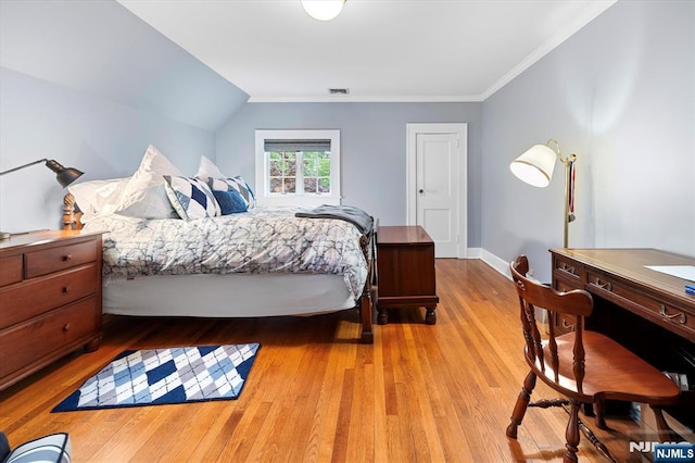 747 Mildred St, Teaneck, NJ 07666 - bedroom with wood finished floors, ornamental molding, vaulted ceiling, and baseboards