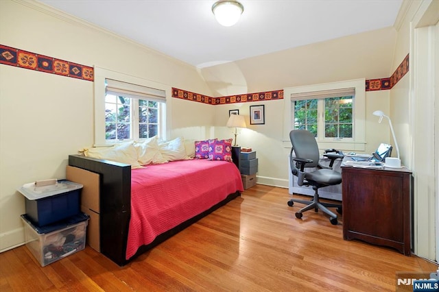 747 Mildred St, Teaneck, NJ 07666 - bedroom with wood finished floors, multiple windows, ornamental molding, baseboards, and vaulted ceiling