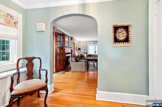 747 Mildred St, Teaneck, NJ 07666 - hall with arched walkways, crown molding, light wood-style flooring, and baseboards
