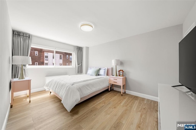 2180 Center 4B, Fort Lee, NJ 07024 - bedroom with baseboards and wood finished floors