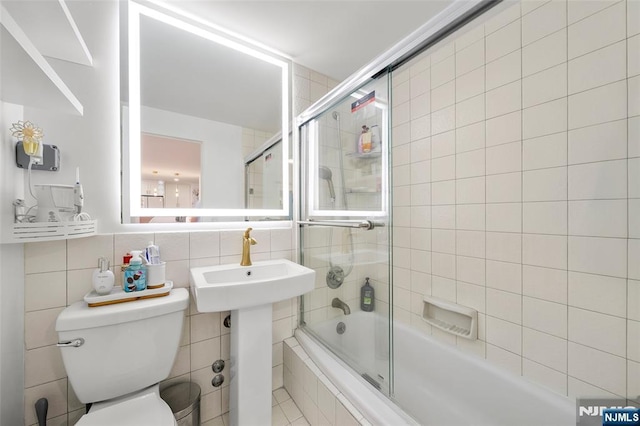 2180 Center 4B, Fort Lee, NJ 07024 - bathroom with tile walls, tiled shower / bath, toilet, a sink, and tasteful backsplash