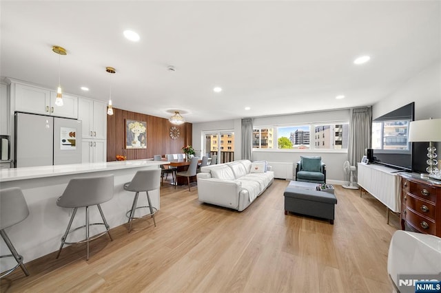 2180 Center 4B, Fort Lee, NJ 07024 - living area with recessed lighting, light wood-style floors, and radiator heating unit