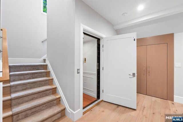 10 Kensington Ct, Tenafly, NJ 07670 - stairs with wood finished floors and baseboards