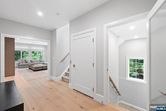 10 Kensington Ct, Tenafly, NJ 07670 - corridor featuring recessed lighting, plenty of natural light, light wood-type flooring, baseboards, and an upstairs landing