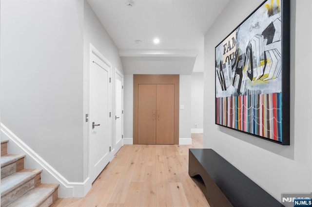 10 Kensington Ct, Tenafly, NJ 07670 - hall featuring light wood-type flooring, recessed lighting, baseboards, and stairs