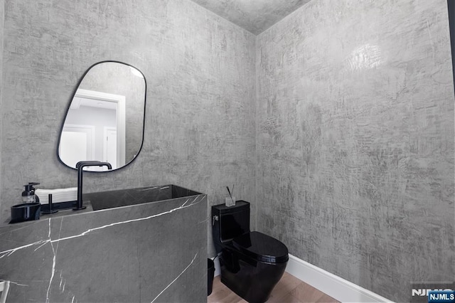 10 Kensington Ct, Tenafly, NJ 07670 - bathroom with wood finished floors and toilet