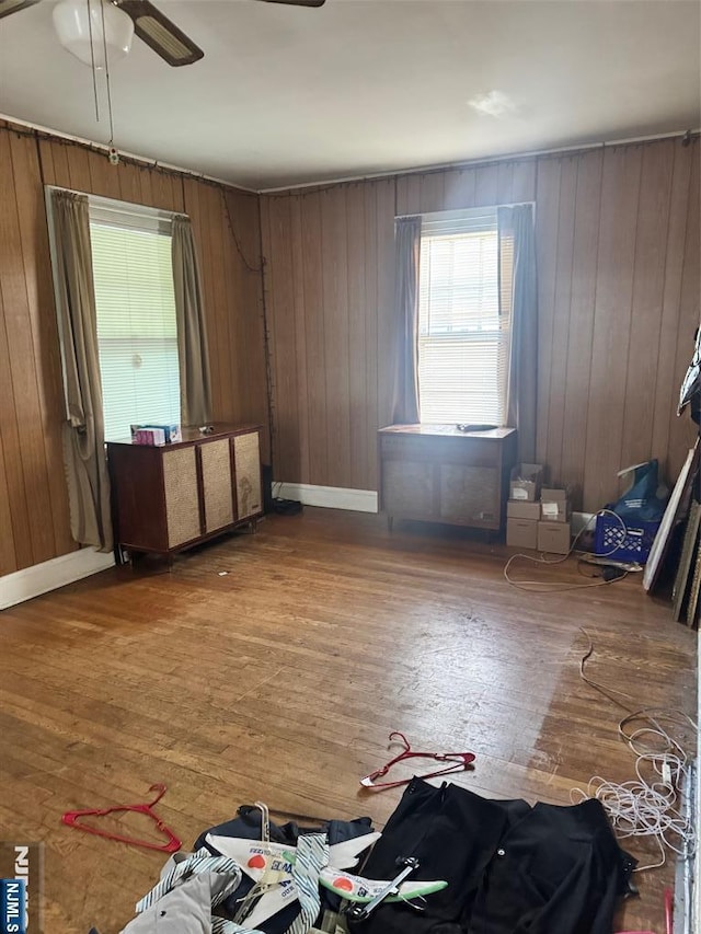 1632 Willever St, Plainfield, NJ 07063 - spare room featuring a ceiling fan, wood finished floors, wooden walls, and baseboards